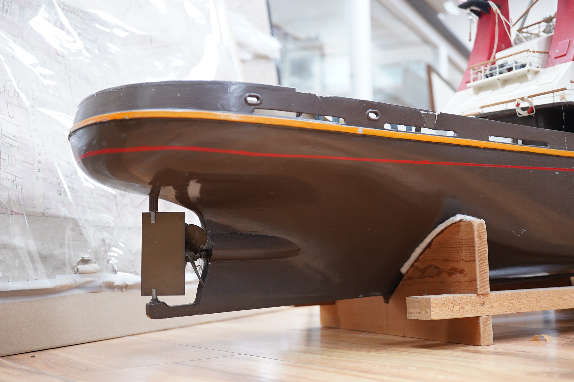 A model of the tugboat Amsterdam, probably built from a kit as a pond yacht, and powered by an electric motor, length of hull approx 103cm, of primarily painted wood construction